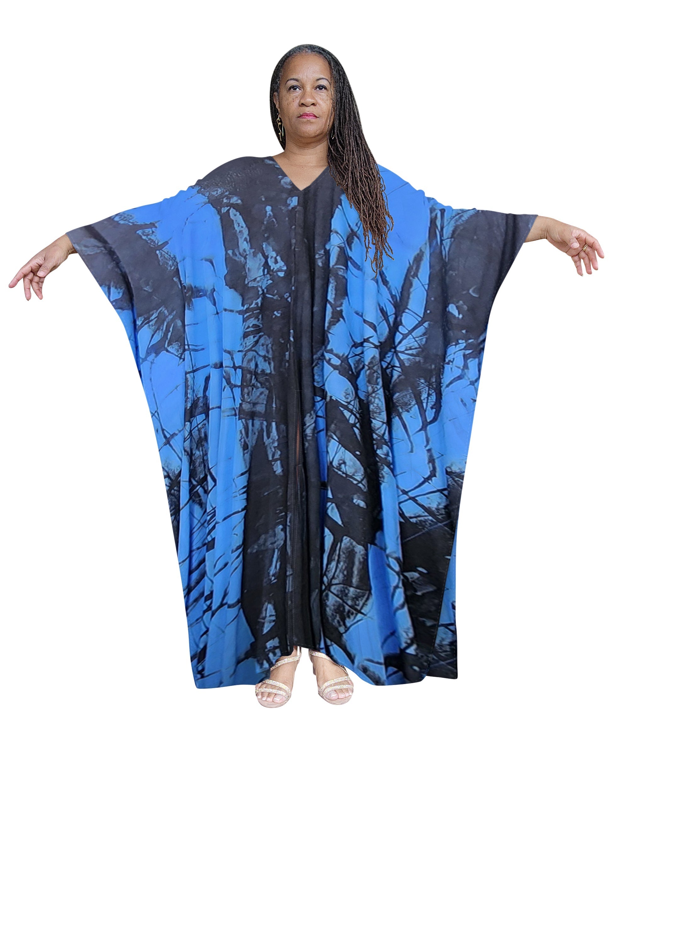Striking blue and black hand-dyed kaftan maxi dress with a bold tie-dye pattern. A statement piece for summer and Memorial Day 2024.