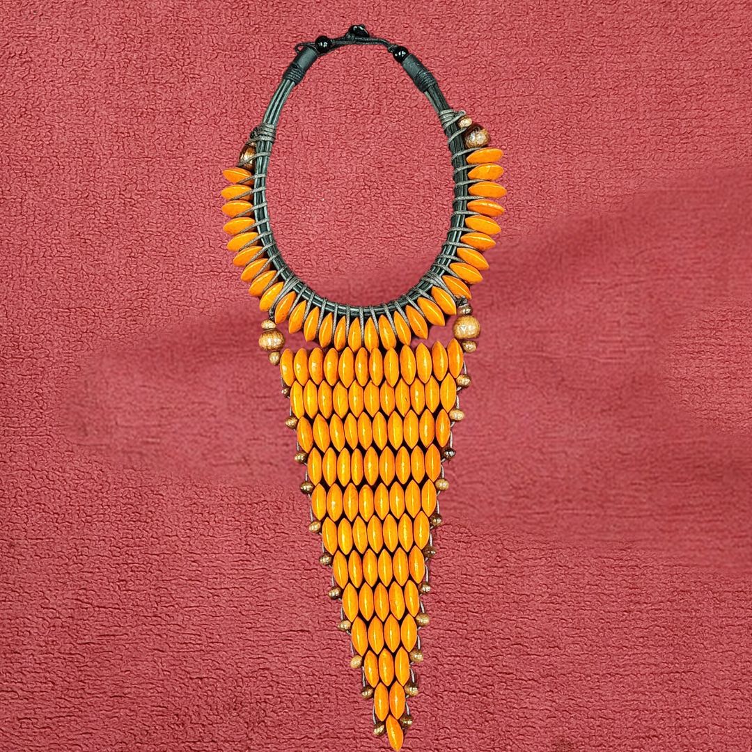 Amber Sunbeam Collar Necklace featuring vibrant orange wooden beads in a cascading design. Handmade African necklace perfect for bold fashion statements.