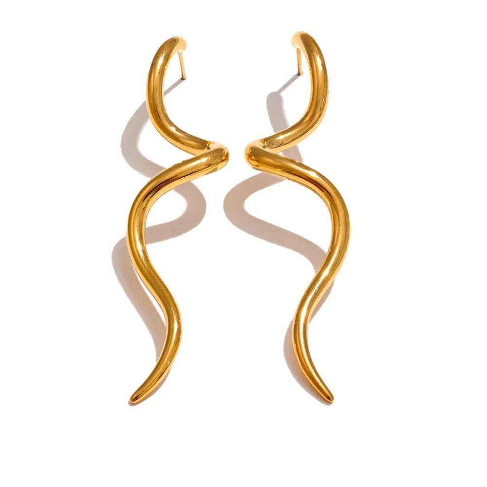 Gold flowing metal geometric long stud earrings with a wavy design, perfect for a bold and creative jewelry statement.