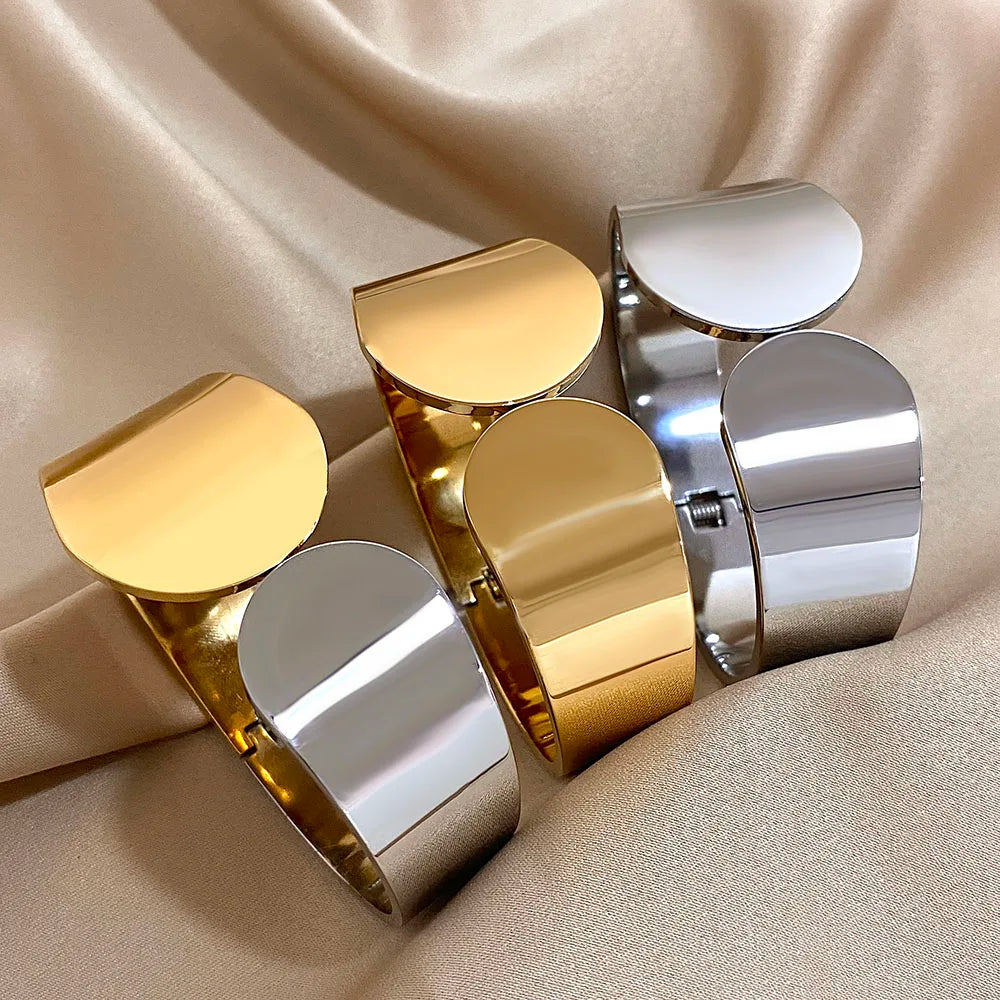 3 sets of the Geometric Glossy Chunky Cuff Bracelet in Gold &Silver. One full gold, one full silver and one half silver and half gold.