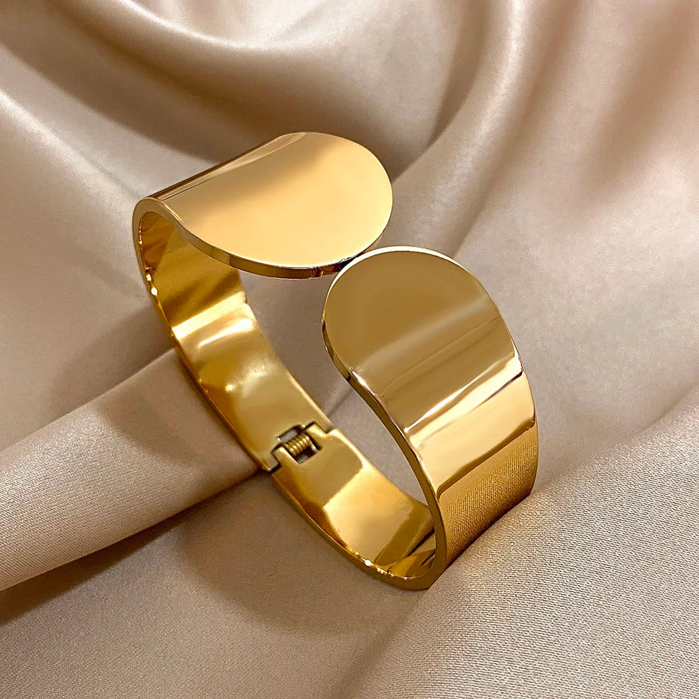 Silver Geometric Glossy Chunky Cuff Bracelet on an brown background