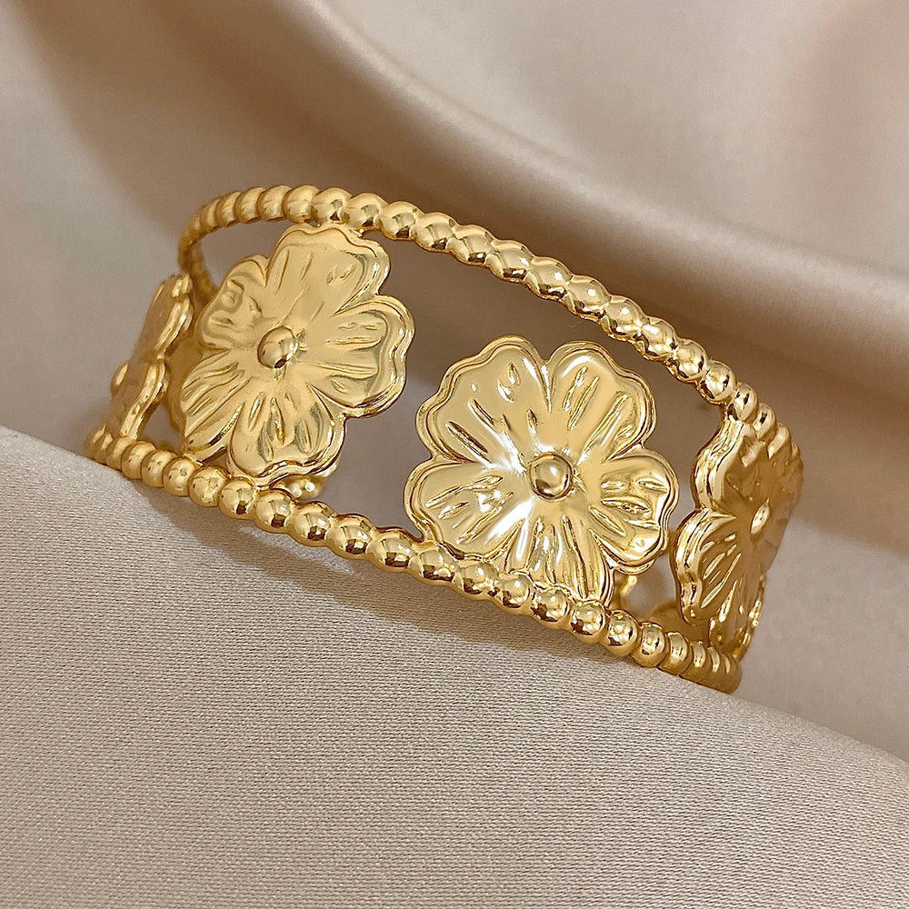 Side angle of Gold Flower Hair Cuff highlighting chunky floral cutout details