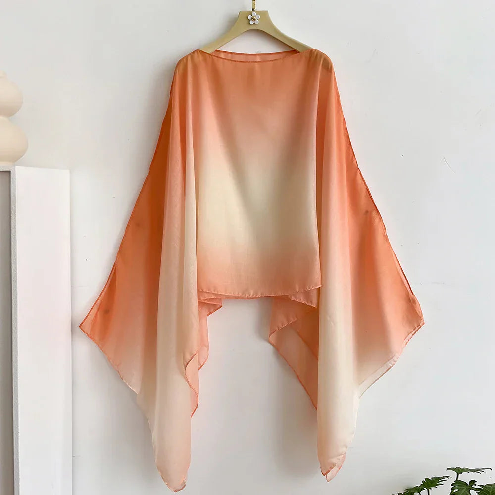 Peach to white gradient sheer shawl with flowing flair sleeves. A lightweight and stylish wrap, perfect for evening or casual wear.