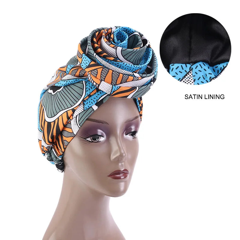 Blue and orange Ankara head wrap with satin lining, designed for hair protection and cultural elegance.