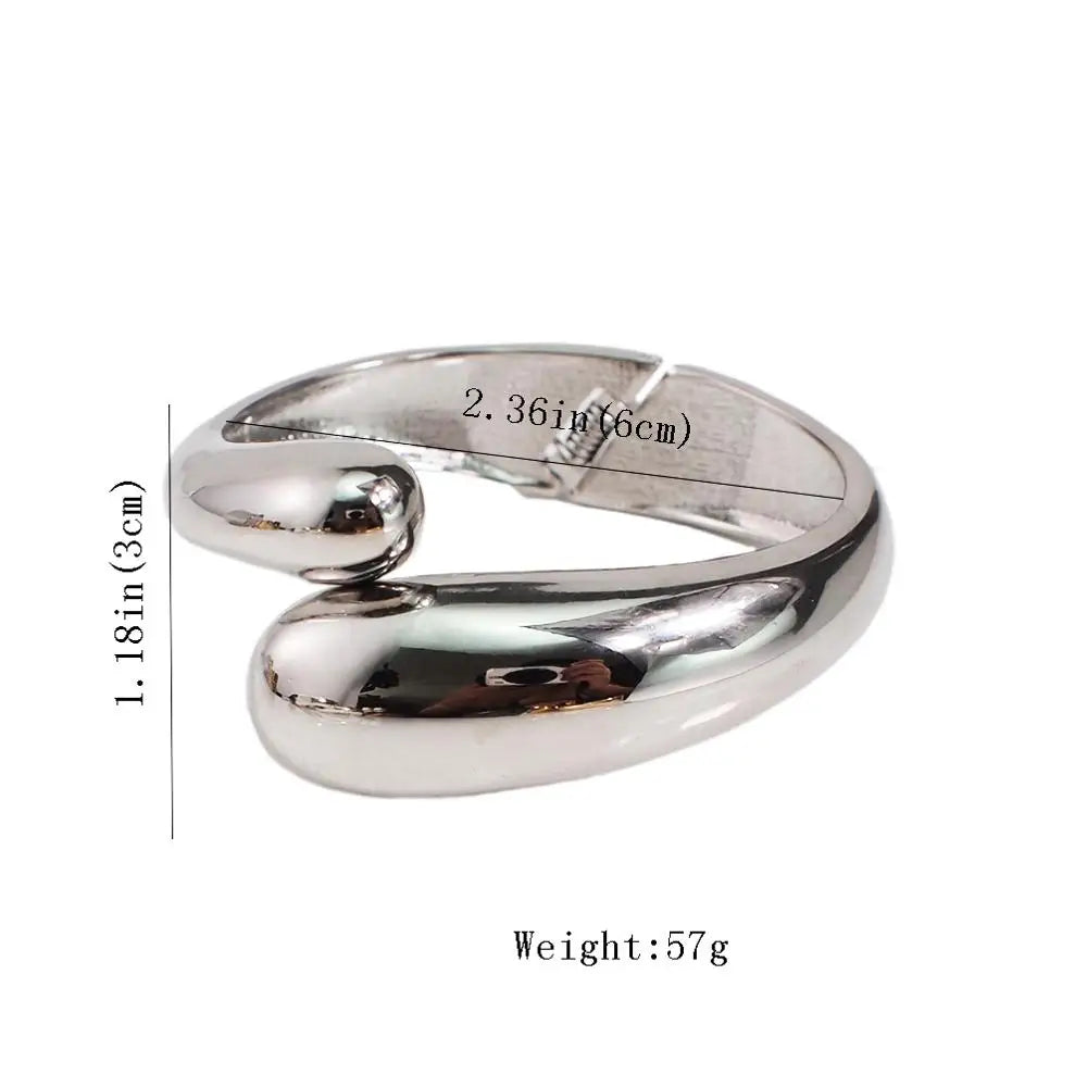 Silver-toned sleek loc cuff with size dimensions. A non-damaging hair accessory designed for locs, dreadlocks, and Sisterlocks.