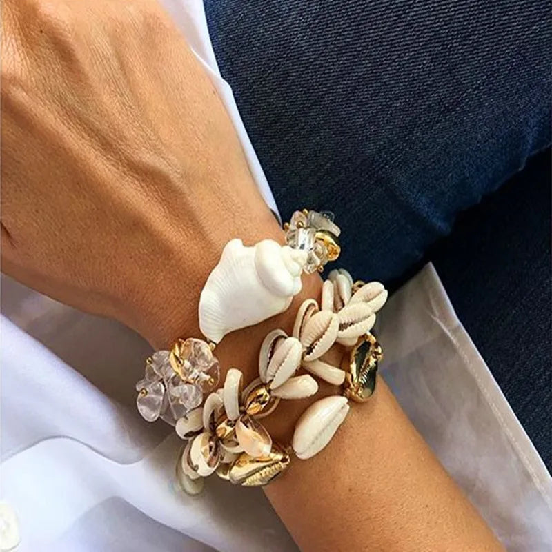 Handmade Cowrie Shell Bracelet with seashell and crystal accents, a stylish accessory for beach outings and special occasions.