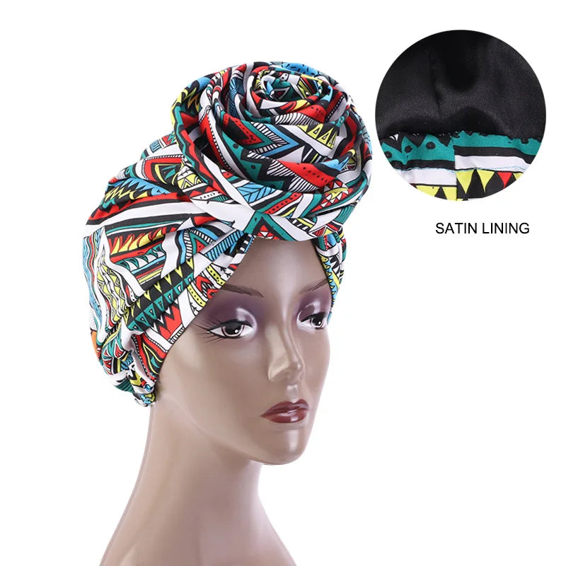 Multicolored Ankara head wrap with satin lining, featuring a geometric African print. Ideal for stylish and protective headwear.