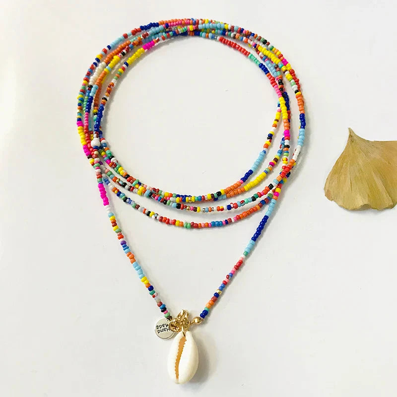 Multilayer Handmade Cowrie Shell Necklace with colorful beads, a trendy and versatile accessory for beachwear and casual outfits.