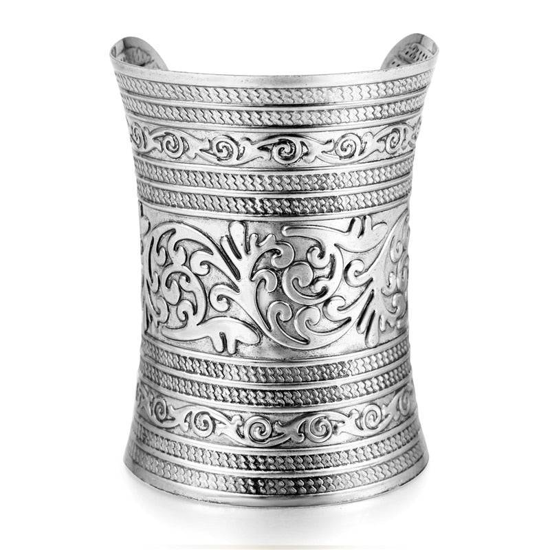 Silver hair cuff with detailed engravings, designed for securing long locs and braids. A stylish and non-damaging hair accessory.
