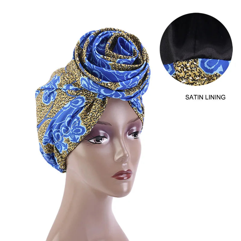 Blue and gold Ankara head wrap with satin lining for hair protection. Elegant and stylish headwear for any occasion.