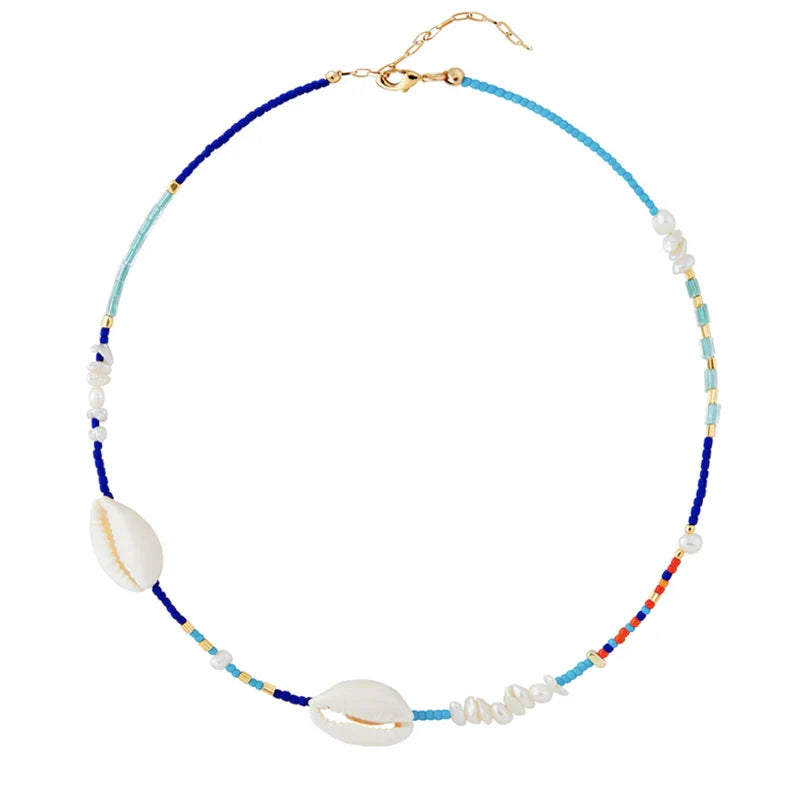 Beaded Handmade Cowrie Shell Necklace with blue and gold accents, a stylish and elegant jewelry piece for any occasion.