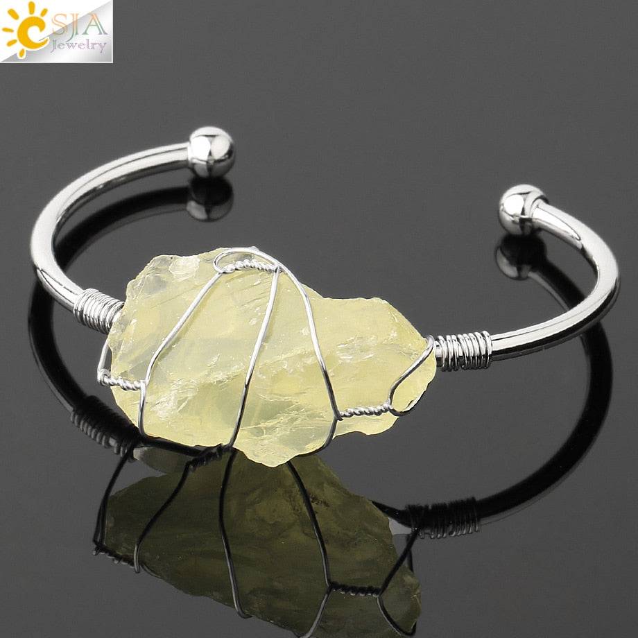 Silver-tone copper bracelet featuring a wire-wrapped irregular citrine crystal quartz centerpiece.