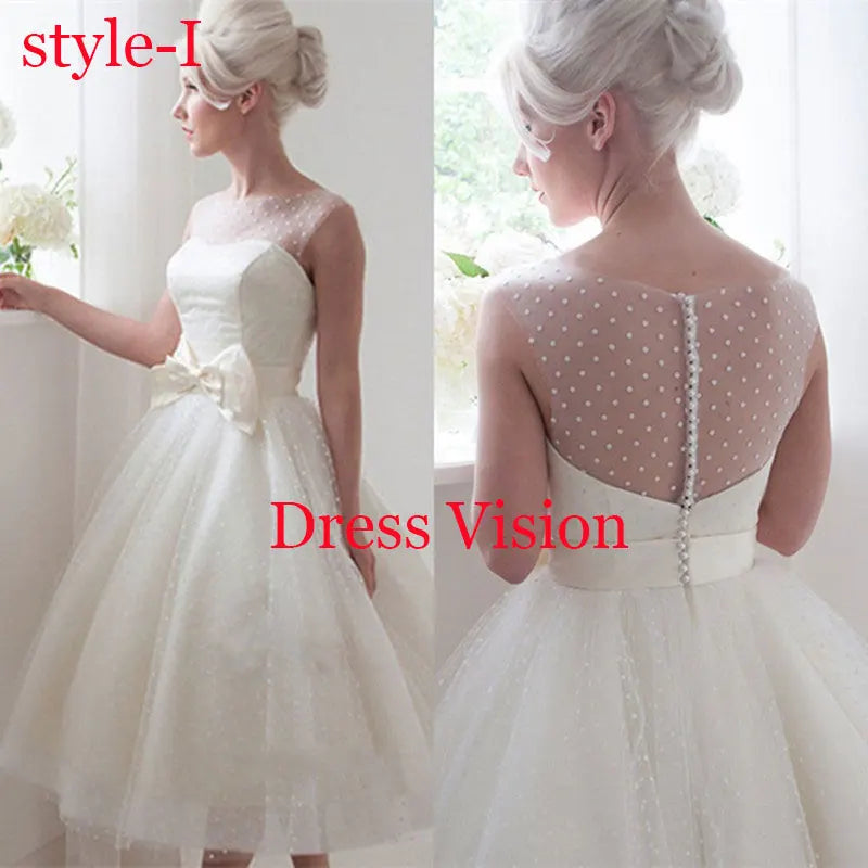 Vintage-inspired white midi dress with polka dot mesh detailing and a bow accent. A charming and elegant bridal gown.
