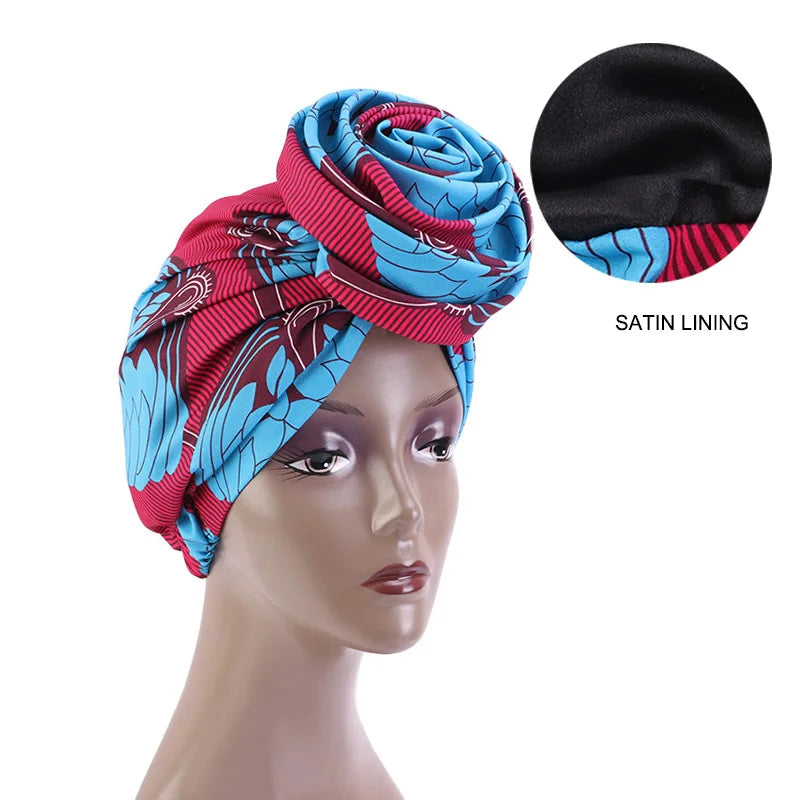 Red and blue Ankara head wrap with satin lining, featuring a bold African print. Ideal for stylish and protective headwear.