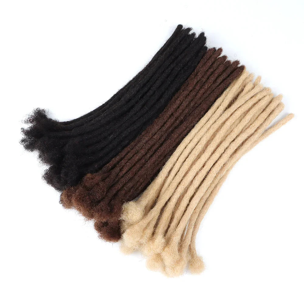 Assorted human hair loc extensions in black, brown, and blonde shades. The 0.6 cm thick locs offer a natural and durable look.