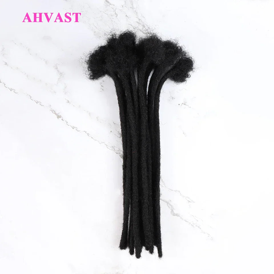 Black human hair loc extensions laid on a white surface. The 0.6 cm thick locs offer a natural and stylish appearance.