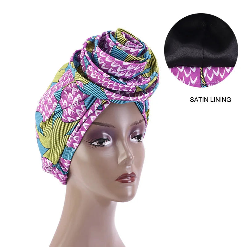 Purple and green Ankara head wrap with satin lining, featuring a bold African print. Ideal for stylish and protective wear.