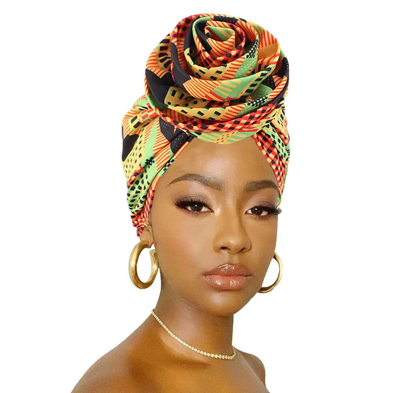 Vibrant Ankara head wrap with satin lining, featuring a bold floral design. Perfect for hair protection and stylish cultural wear.