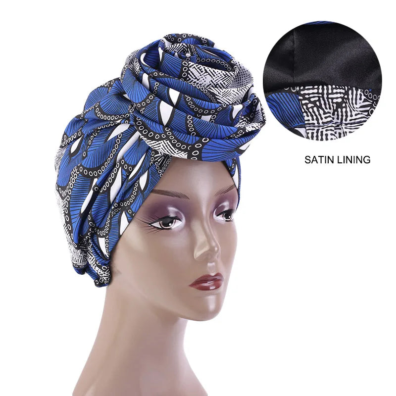 Blue and black Ankara head wrap with satin lining, featuring a geometric African print. Ideal for stylish and protective wear.