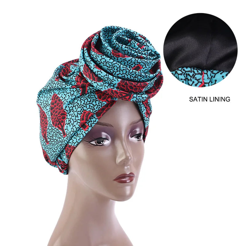 Blue and red Ankara head wrap with satin lining, featuring a bold African print. Perfect for stylish and protective wear.