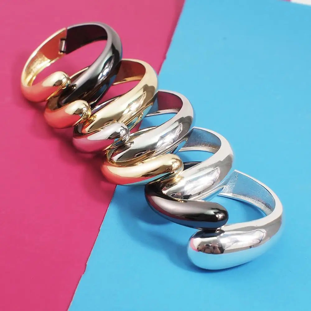 Collection of sleek loc cuffs in various metallic finishes. Stylish and non-damaging hair accessories for locs and special occasions.