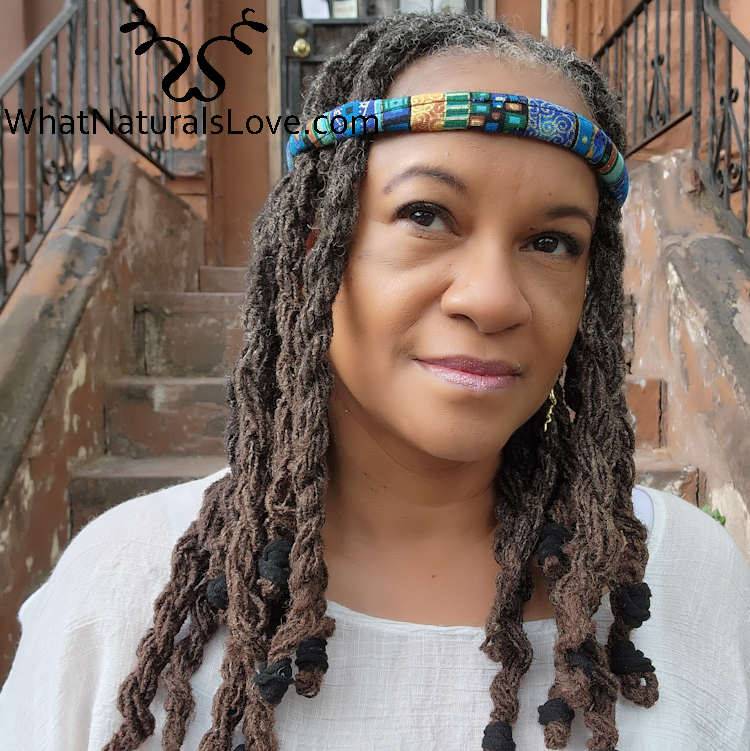 Woman wearing a blue moldable hair tie as a headband for locs. A stylish and comfortable accessory for Sisterlocks and braids.
