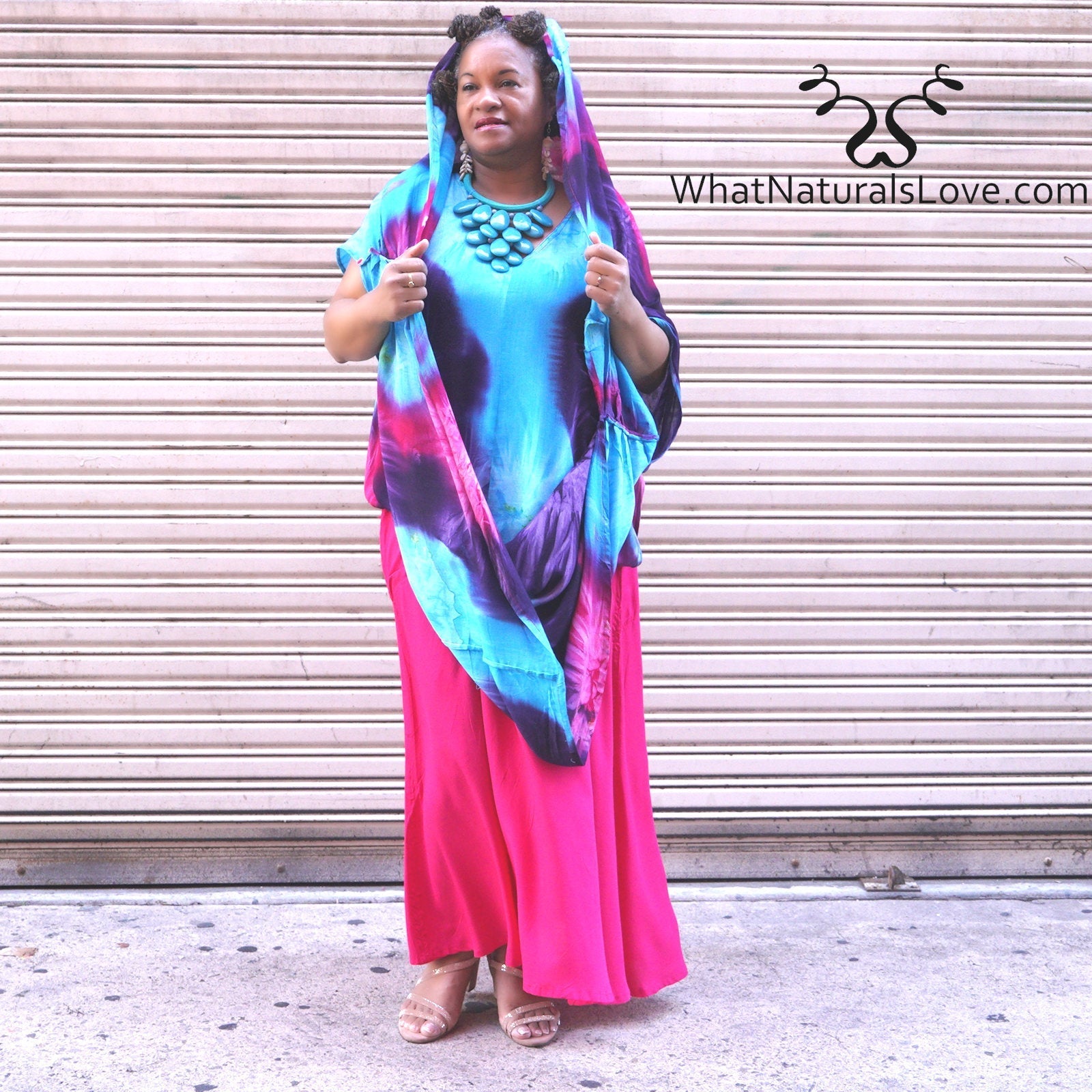 Moroccan Magic Dress Tye Dye worn with a hooded drape, showcasing its multi-wear versatility. A stylish and elegant long dress for women.