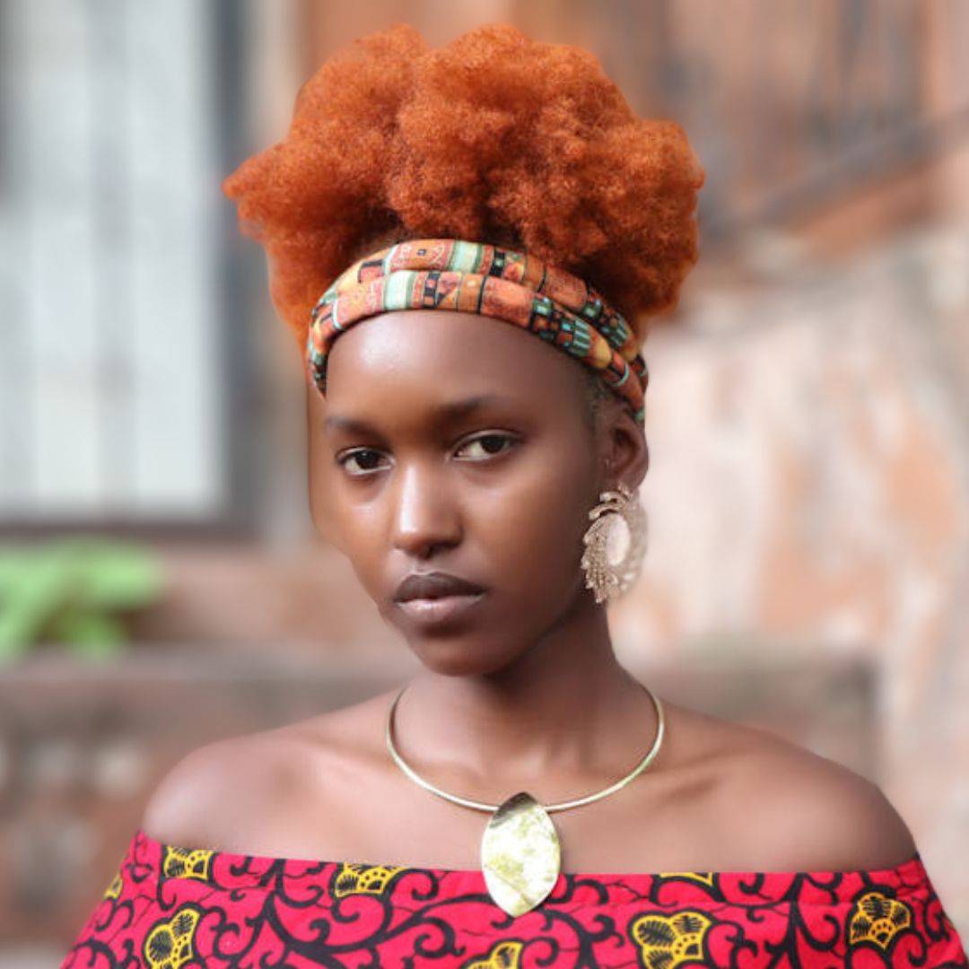 Model with afro puff wearing a colorful moldable hair tie. A perfect accessory for natural hair, locs, and braids.