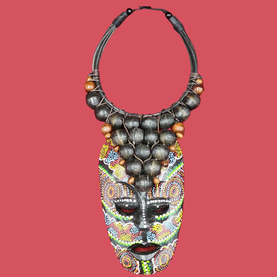 Mystic Tribal Harmony Necklace featuring a handcrafted African-inspired wooden beaded design with a vibrant painted tribal mask pendant.