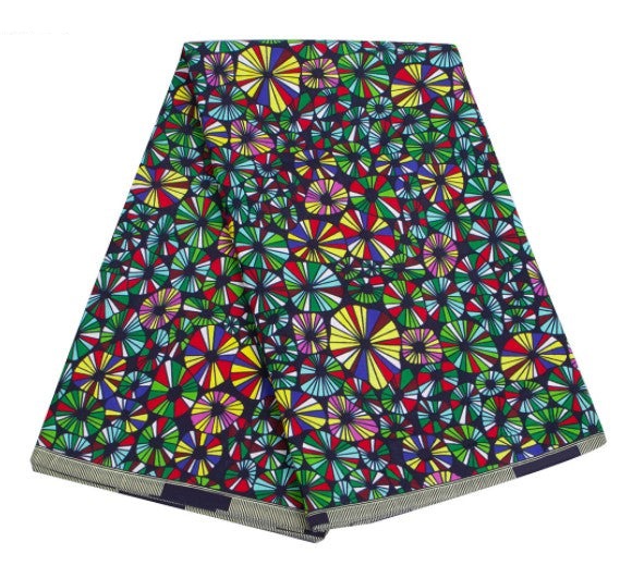 African fabric with a colorful starburst pattern, ideal for making headwraps or clothing. A bold and stylish textile choice.