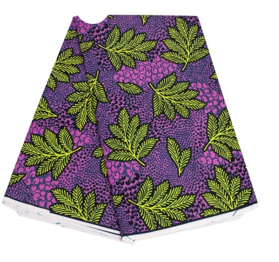 African fabric with purple and green leaf patterns, perfect for headwraps or clothing. A stylish and cultural textile option.