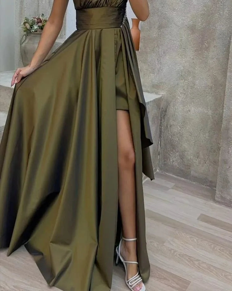 Close-up of an olive green satin one-shoulder maxi dress featuring a stylish side slit. A sophisticated choice for evening occasions and proms.
