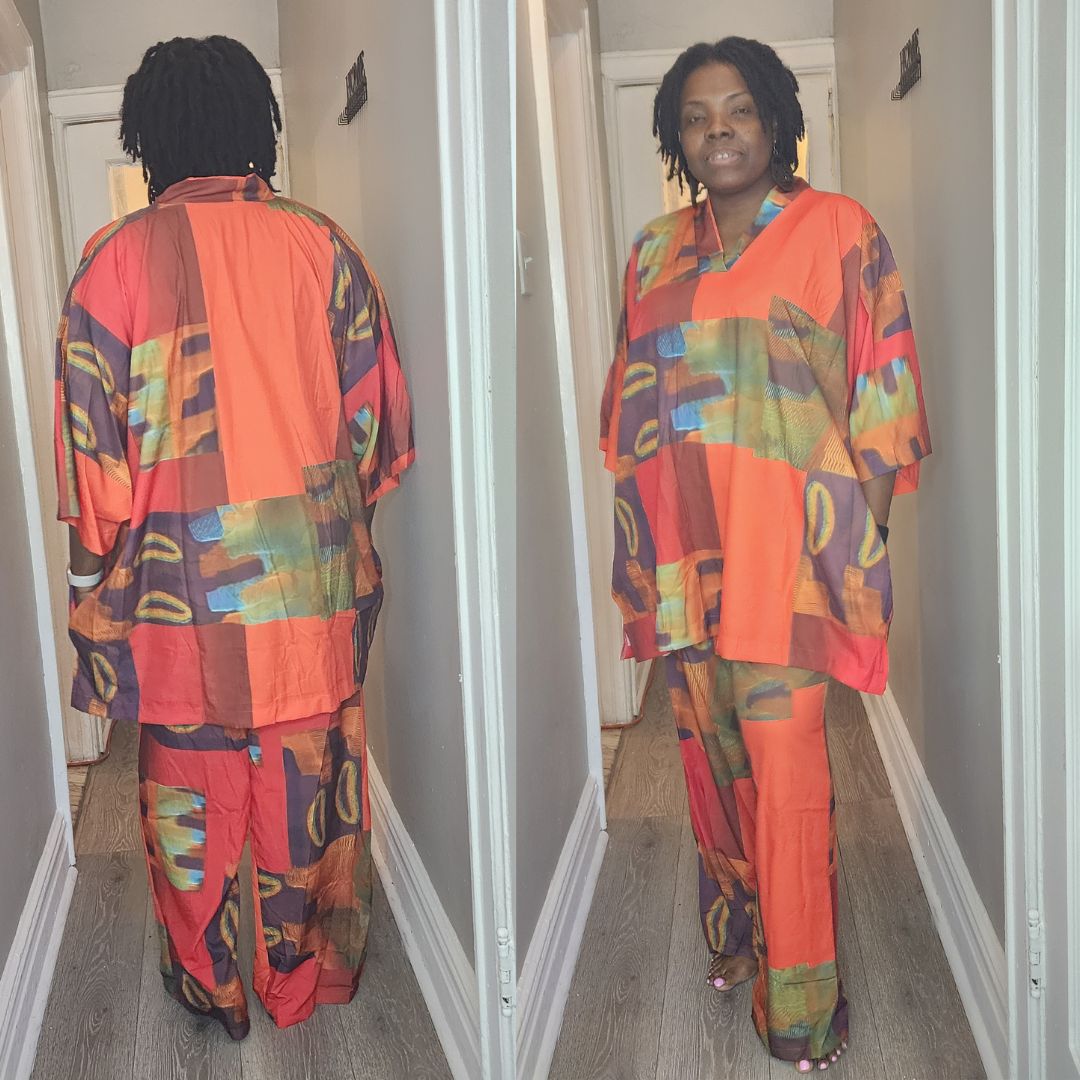 Stylish two-piece pants set with a loose-fitting top and matching pants in vibrant orange and multicolor abstract prints.
