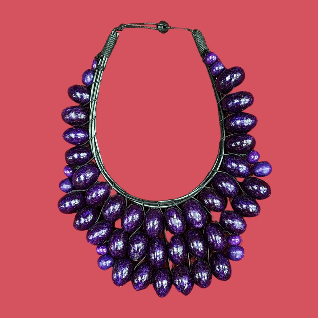 Regal Amethyst Cascade Necklace featuring handcrafted wooden beads in deep purple hues. A bold statement piece for elegant and cultural fashion.