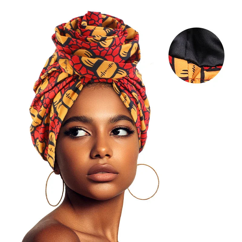 Red and gold Afrocentric Melody Headwrap with satin lining, featuring a unique African-inspired pattern. Pre-tied for easy wear and a stylish look.