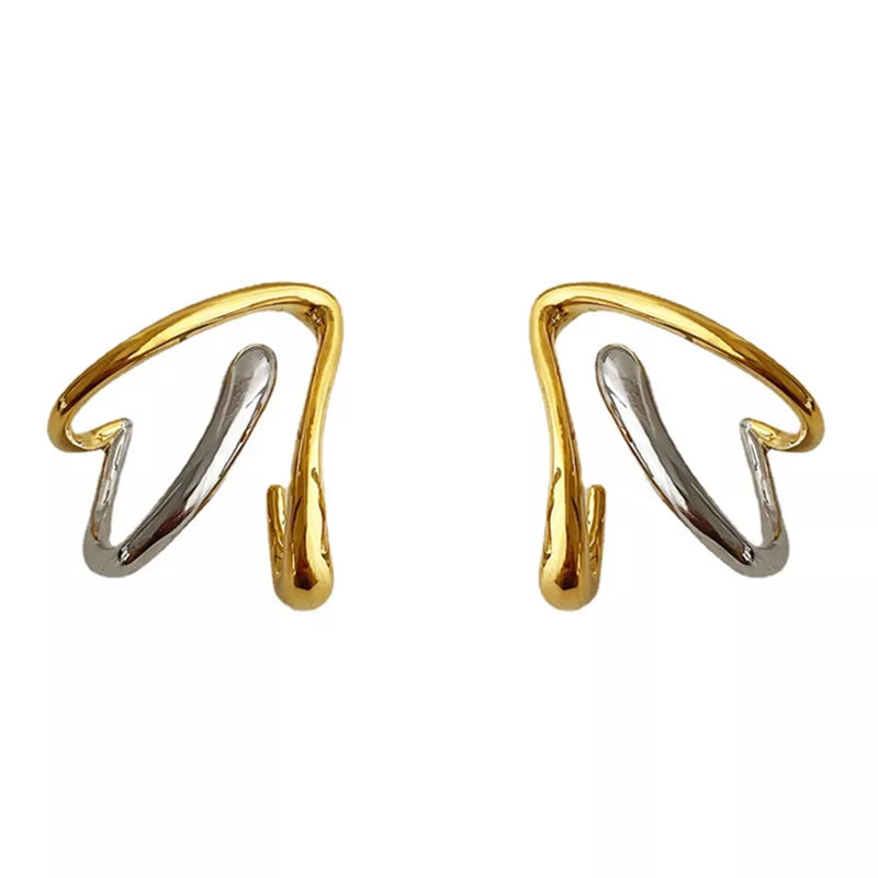 Gold and silver heart-shaped earrings featuring a geometric spiral design. These vintage-inspired earrings make a fashionable statement for any occasion.
