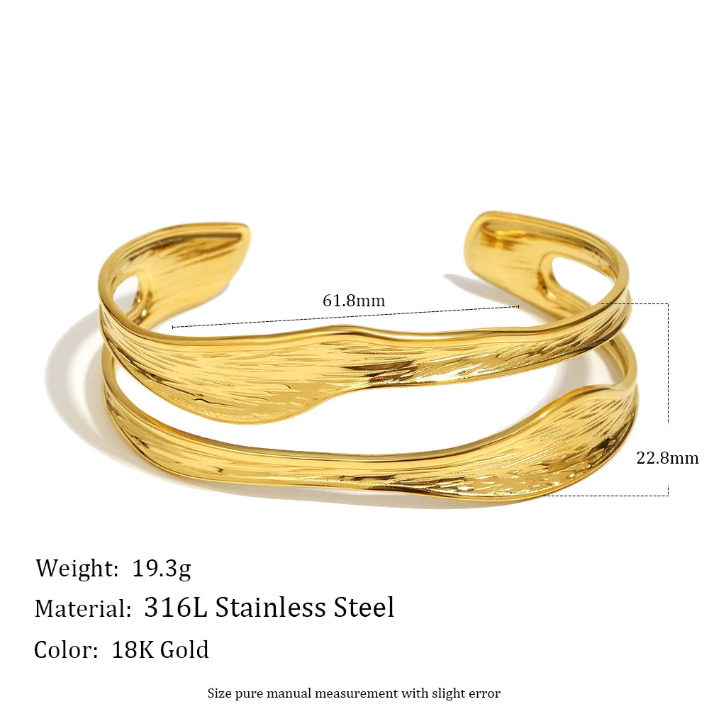 Gold bracelet with measurements and material details on a white background