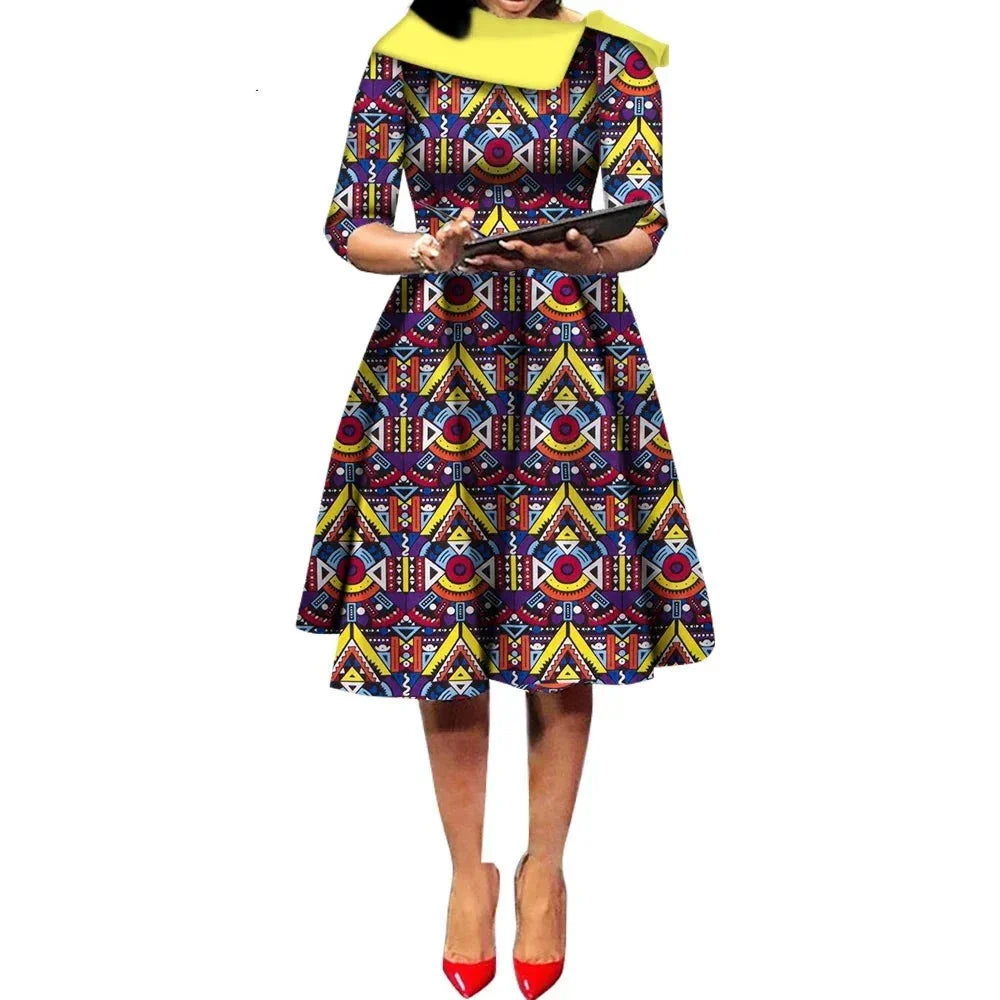 African Ankara Wax Print Midi Dress with a bold multicolored geometric pattern, featuring three-quarter sleeves.
