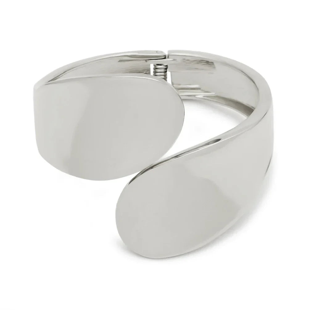 Polished silver cuff bracelet with a bold, modern design. A stylish and elegant accessory for special occasions.