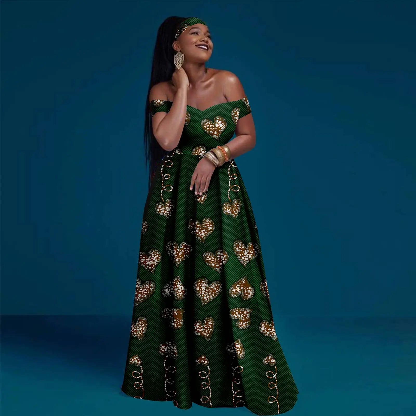 Woman wearing a green dress with gold heart patterns on a blue background