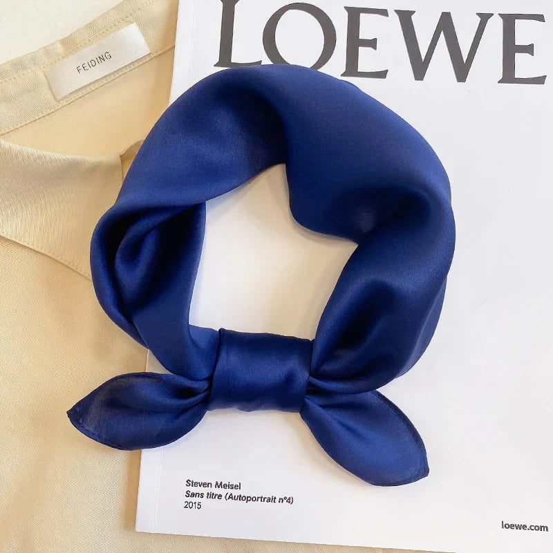 Silk Bandana Scarf - Ivory Elegant in deep navy blue, crafted from 100% pure silk with a smooth, lustrous finish. Perfect for elevating any outfit.