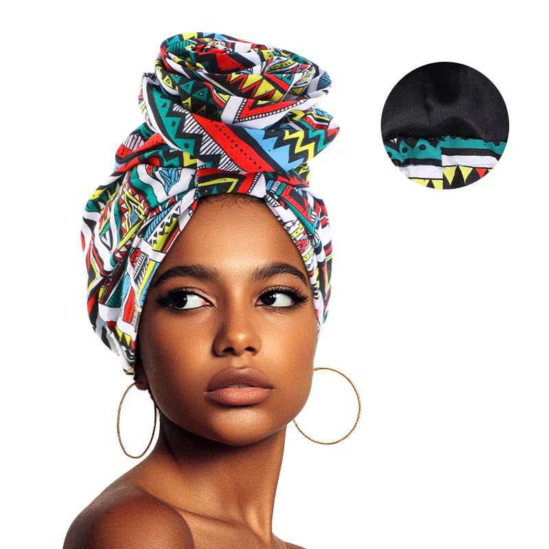 Multicolored Afrocentric Melody Headwrap with satin lining, offering a mix of geometric patterns. A stylish and protective hair accessory for women.