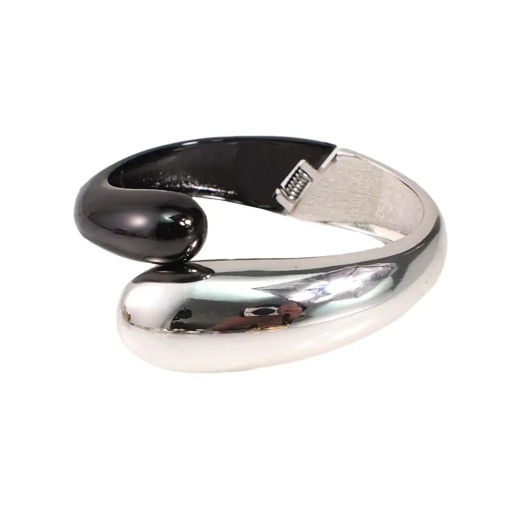 Black and silver sleek loc cuff with a modern, curved design. A non-damaging hair accessory for locs and dreadlocks.