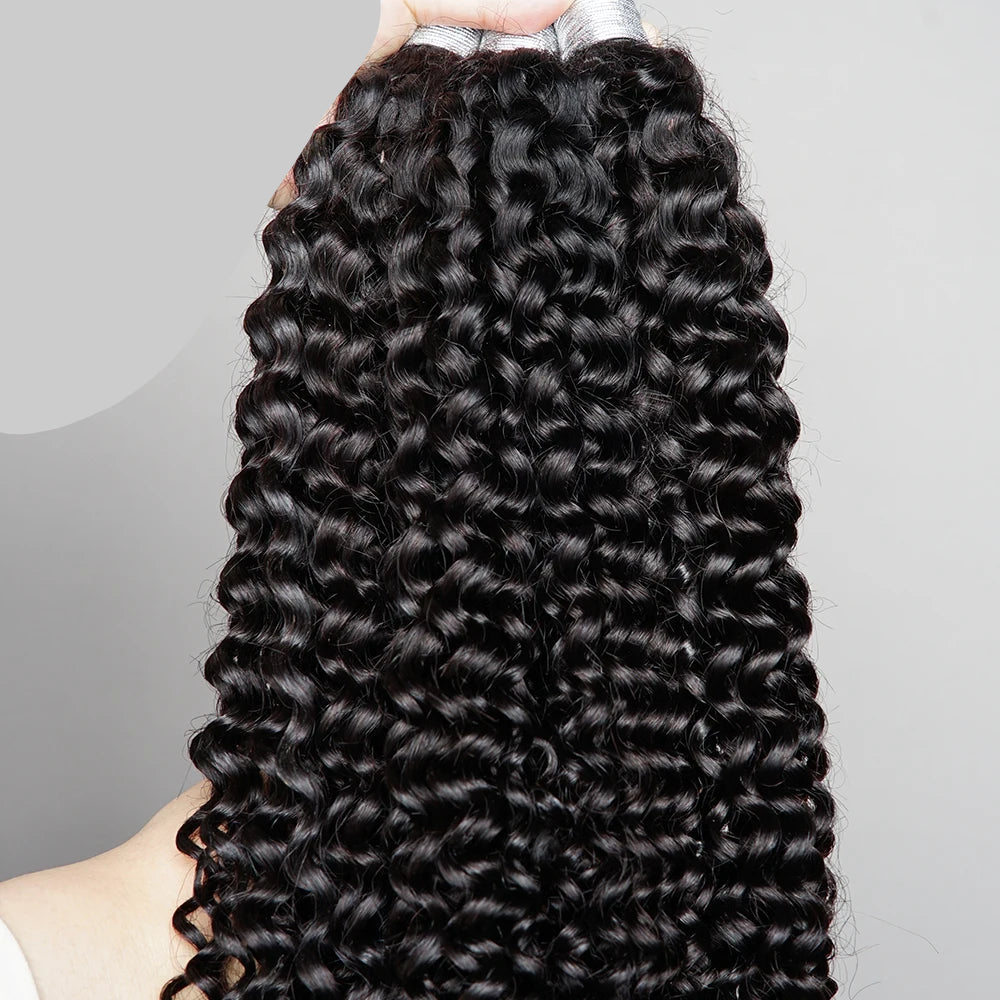 Black curly hair extensions held by a hand with Bobbi Collection branding.
