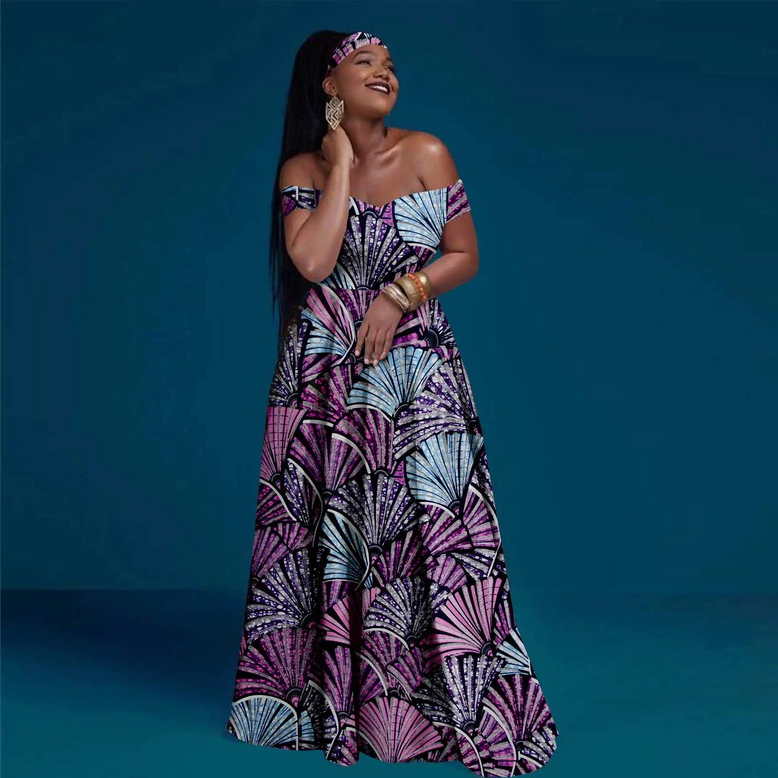 Woman wearing a colorful patterned dress against a blue background