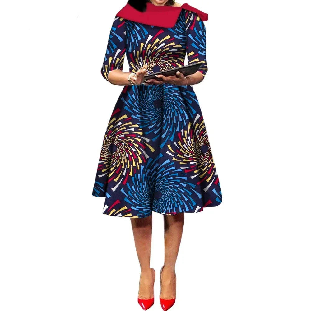 African Ankara Wax Print Midi Dress with a navy blue base and colorful spiral patterns, featuring three-quarter sleeves.