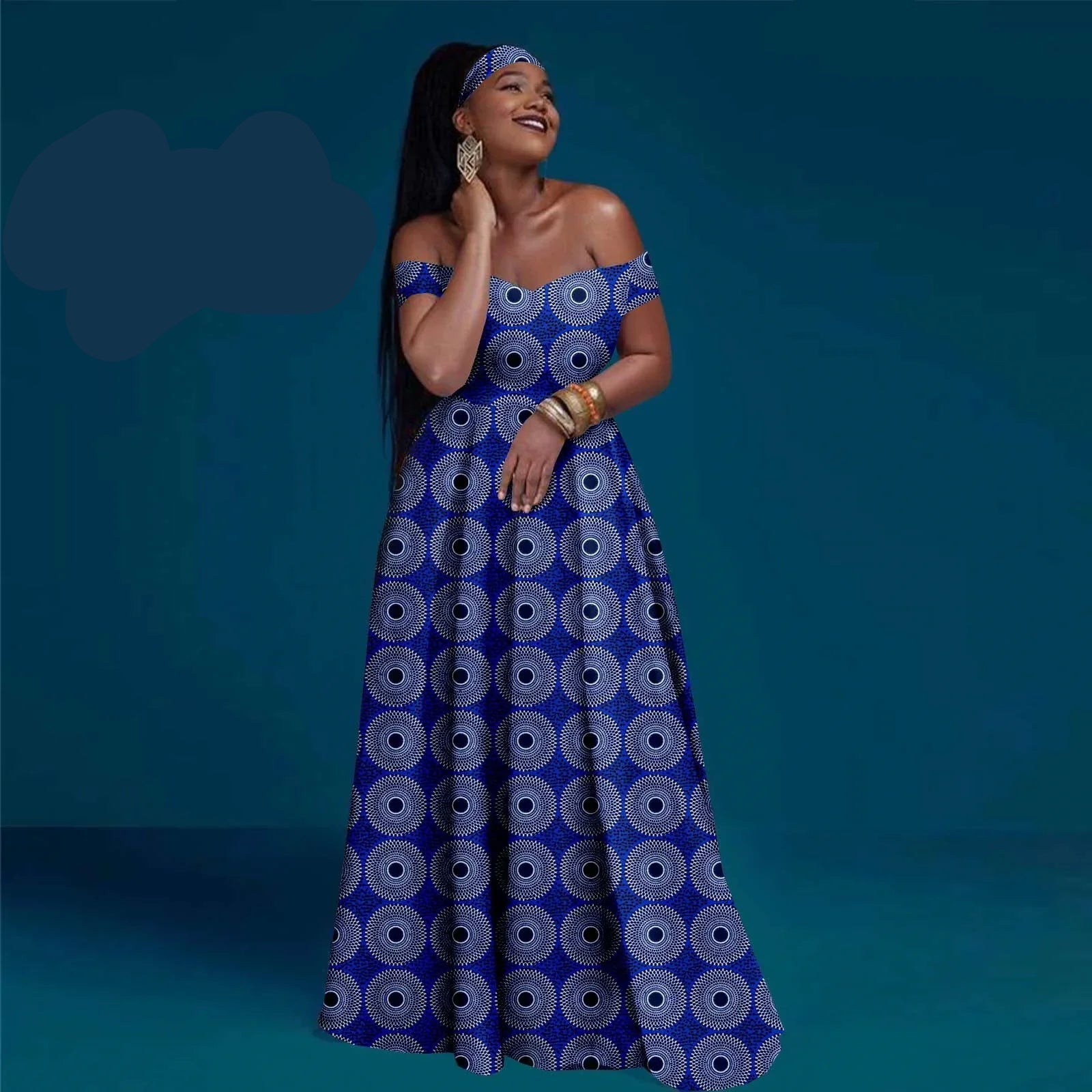 Woman wearing a blue patterned dress with &
