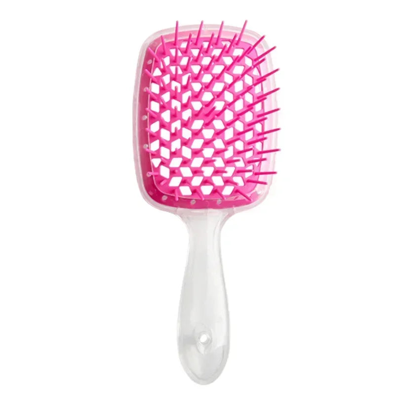 White detangling brush with pink bristles, designed for curly hair. Helps reduce breakage and ensures smooth, effortless detangling.