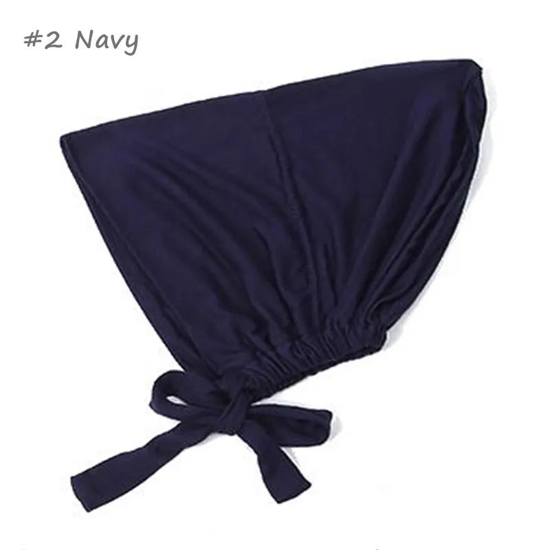 Navy blue adjustable headwrap with a gathered elastic and tie-back closure, offering a secure and stylish fit.
