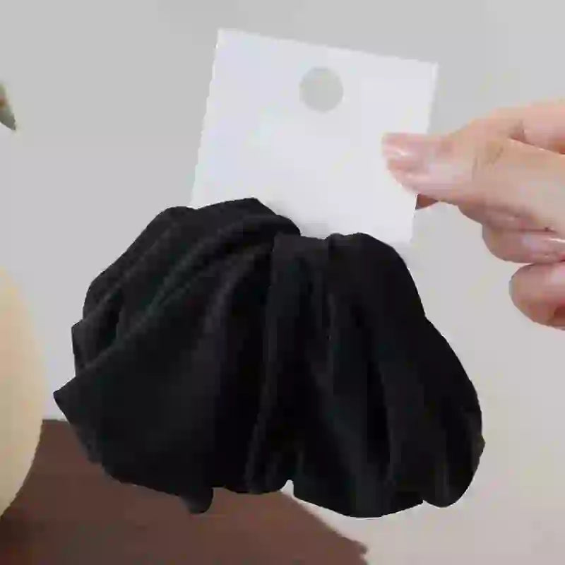 Black non-damaging hairbands for locs and natural hair. Soft, thick bands designed for secure and gentle styling.